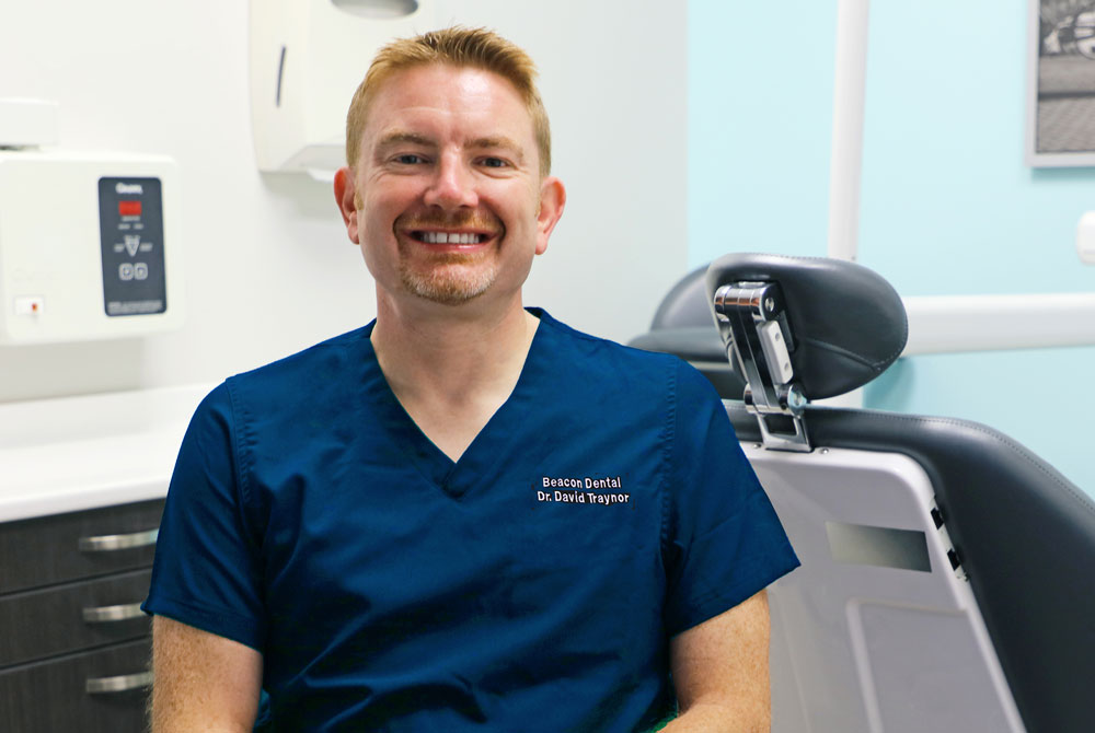 portrait of Dr. Traynor smiling in the office